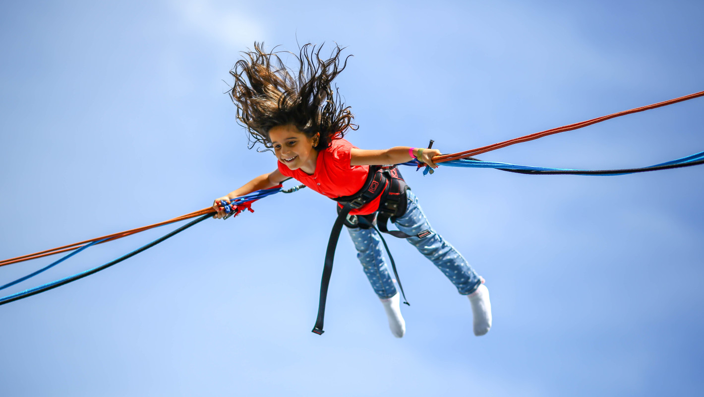 Young girl bungee jumping